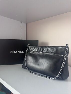 CHANEL Black Leather Chain Shoulder Bag with Embossed Logo